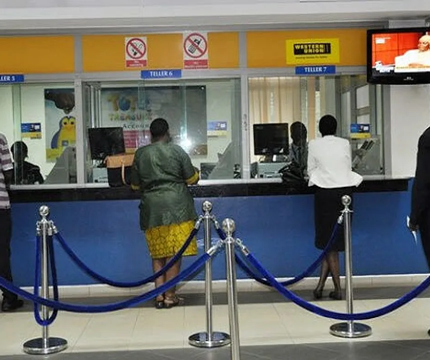 Customers at a bank teller counter